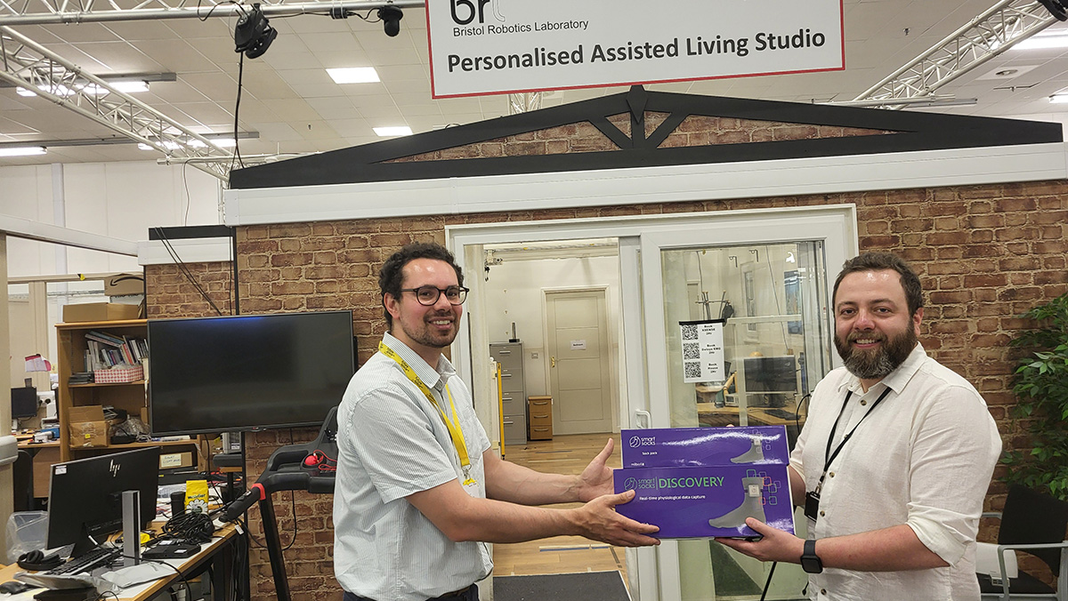 Zeke Steer of Milbotix handing over SmartSocks DISCOVERY to Carlos Cifuentes of the BRL